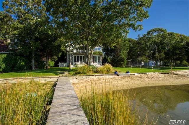 Exquisite Waterfront Home With Open Floor Plan, Soaring Ceilings And Sliders To Backyard Patio That Overlooks The Water, Including Your Very Own Dock. Includes All Top Of The Line Amenities, Cac, Beautiful Kitchen With Ss Appliances, Master Suite With Deck. Enjoy Fishing, Kayaking, Boating All Right From Your Back Door At This Remarkable Summer Retreat!
