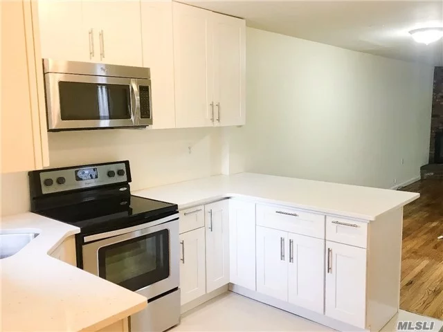 Beautiful 2 X 2.5 Townhouse W/3 Floors Of Living Space! Hard Wood Floors & Open Floor Plan-New Kitchen/Dining/ Living Room W/Fireplace & Sliders To Private Deck + Half Bath On The First Floor. Upstairs Has High Ceilings & 2 Spacious Bedrooms, Each W/Full Bath. Finished Basement W/Laundry + Garage/Storage & Driveway, Near Beach, Pool & Tennis.