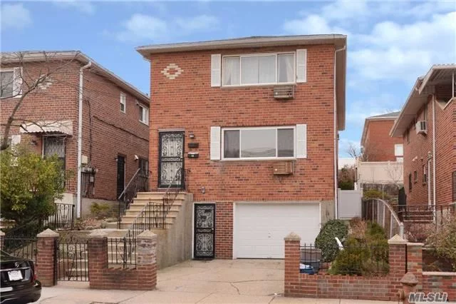 Spacious 2-Family Detached Home. Convenient To Shopping & Transportation - Walk To Lirr, Q12 & Q13, Express Bus To Manhattan. Roof 8 Years Old. Oversized 1-Car Garage.