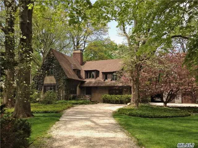 This Charming Storybook Tudor Features, Formal Living Rm W/ Fireplace & Hardwood Floors, Large Cozy Sun-Drenched Den, Eat-In-Kitchen Leads To Formal Dining Room W/ Solarium. Six Bedrooms Including Maids Quarters. Tucked Away On Private Road. Cac, Ing Sprinklers, 2 Car Garage & Basketball Court, A Must See!