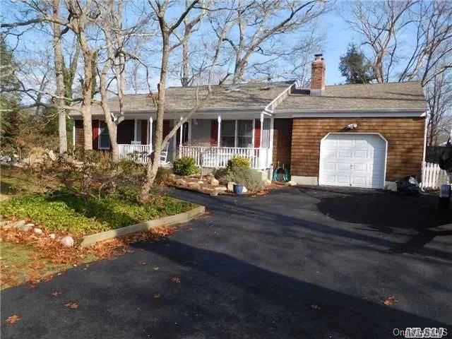 Cedar Shake Country Ranch. Living Room With Vermont Castings Fireplace, Large Country Kitchen, Master Bedroom With Bath Plus 3 Bedrooms And Bath. Screened Porch & Covered Front Porch, Deck, Basement, Garage, & Hot Tub. Room For A Pool. Just 2 Blocks To Sandy Bay Beach.