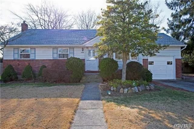 This Mid-Block Ranch Is Loaded With Potential! Meticulously Well Maintained, This Sun-Drenched Home Boasts Hw Floors Throughout (Under Carpet) A Large Extension W/ Den And 1/2 Bath. Roof Less Than 5 Yrs Old, Gas Heating System Approx 7 Years Old. Full Basement. Great Opportunity!