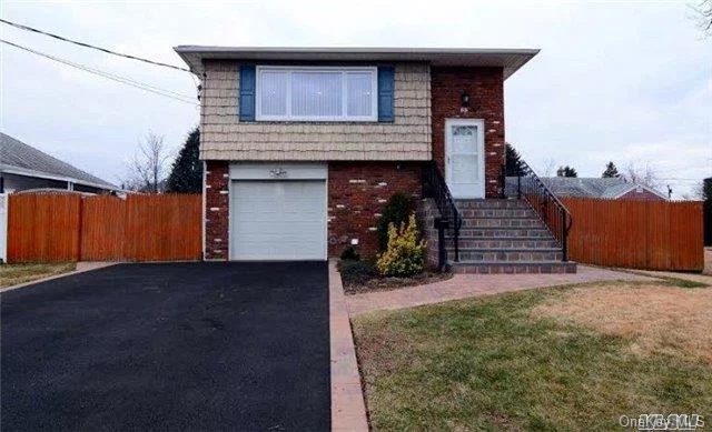 Spacious Renovated In-Line Hi Ranch Home Located Mid-Block In Bethpage Features 5 Bdrms, 2 Fbths, Updated Kitchen Granite Countertop, Ss Appliances, Hard Wood Floors, Ductless Cac, Fully Fenced Back Yard, Lots Of Room For Extended Family, Great Location In Quiet Residential Neighborhood, Move In Ready!