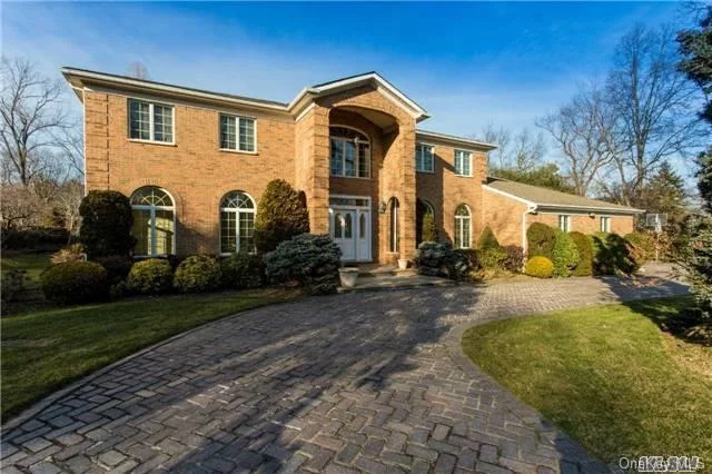 Buiders Own, Solid Brick 5 Br, 6.55 Bth Colonial Majestically Situated On 1+ Acre Of Park-Like Grounds. Over-Sized Two Story Entry Foyer Leads To Grand Entertaining Rms W/Custom Design Moldings & Panelling. Ig Heated Pool W/ Poolhouse. Huge Patio W/Brick Pizza Oven & Built-In Bbq. Fully Fin Bsmt & Generator.