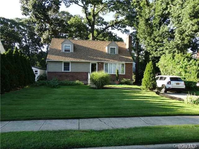 Amazing Wide Line Brick Cape On Over Sized Lot, Great Location, On A Quite Tree Lined Street. Near Rail Road, Bus, Shopping, Park, Parkway, Lie, Near Schools, Roslyn Schools(Top Four District In Nassau). Houses Of Worship. Renovated Kitchen With Ss Appliance, Open Floor Plan, Finished Basement, Great Upstairs, New Roof, New Heat, Renovated Second Floor Bath.