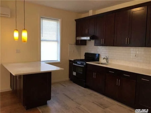 Brand New Renovation. Hard Wood Flooring, All New Appliances. Beautiful Contemporary Style Eat In Kitchen With Countertop Island. Many Windows Throughout The Apartment With Lots Of Natural Light. Bus Stop Right In Front Of The Building, Available In The Q6. 15 Minutes Bus Ride To Lirr Jamaica Station, Subways Are Also Available In The Z, J, E.