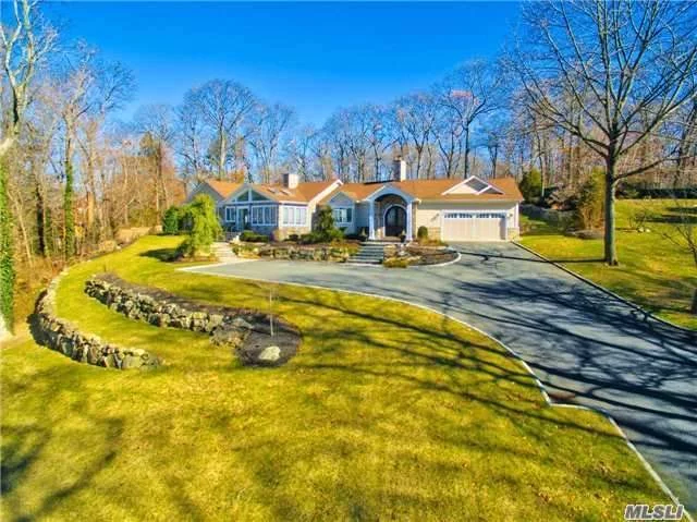 Standing Majestically Atop One Picturesque Syosset Acre Is This Spectacular Diamond Sprawling Hampton Style Ranch. Gorgeous Plantings And Towering Trees Adorn The Flowing Emerald Lawns. An Elegant Front Portico, Complete With Iron Filigree And Glass Entry Doors, Welcomes You. Be Prepared To Be Awestruck By It&rsquo;s Fine Interior Finishes And Country Club Backyard.