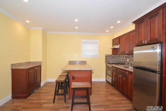 Newly Renovated Beautiful 2 Br, 1 Bath Upper Unit Located In The Heart Of The West End Of Long Beach, Municipal Parking Lot Is Across The Street, Shared Outdoor Space And W/D. Move Right In To This Turn Key Apt.