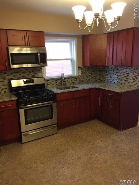 Huge One Bedroom Apartment In A Private Family Home! Newly Renovated With Cherry Wood Kitchen Cabinetry, Gorgeous Open Kitchen/ Dining Area , Granite Countertops, Stainless Steel Appliances! New Hardwood Floors Throughout, 6 Panel Oakwood Doors!! Beautiful Large Bedroom With Cac, Heat And Hot Water Included.