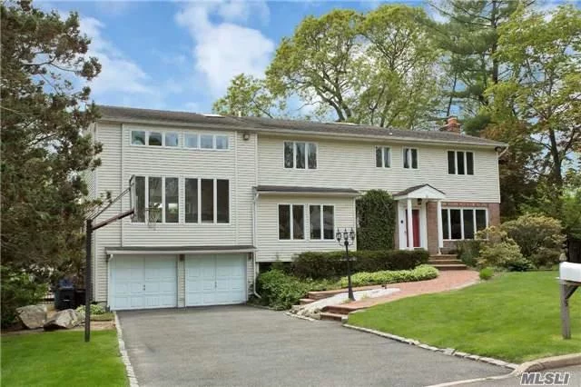 This Spacious Post Modern Colonial Family Home Is Situated In One Of The Most Desirable Areas Of Glen Cove On A Quiet Cul De Sac! The Gracious Home Features: High Ceilings With An Open Floor Plan & Over Sized Windows, Gourmet Eik With A Granite Center Island With The Bkfst Nook Leading To A Beautiful Walk-Out Deck, Wood Flooring Thru Out, And All Updated Baths. 2Much2List!