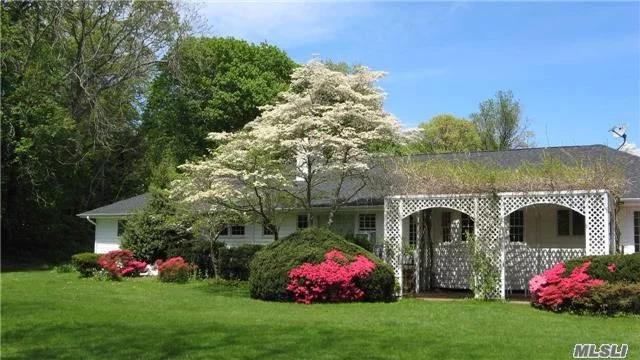 Tucked Away Spacious Ranch On 4.29 Acres With Inground Pool, In The Heart Of Lattingtown. Sloping Lawns With Picturesque Land And Mature Plantings.