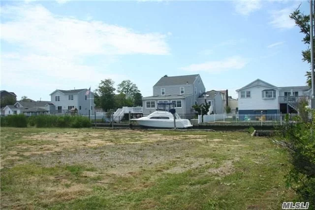 Oversized Waterfront Property With 115 Feet Of Bulkhead On A Wide Canal. This 9, 200 Square Foot Vacant Lot Is Ready To Build Now. Gorgeous Views And Moments From The Great South Bay. The Land Borders A Town-Owned Empty Lot On The South Side For Additional Space And Privacy.