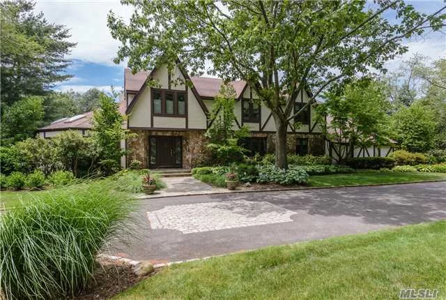 Exceptional Tudor Style Residence - High Vaulted Ceilings, Skylights, Spacious Sun-Drenched Principal Rooms, Gourmet Kitchen, Hardwood Floors, Beautiful Master Suite, Finished Lower Level And A Spectacular 2 Acre Country Club Property With Gunite Pool And Har Tru Tennis Court. Great For Entertaining. Must See To Appreciate. Syosset School District Sd #2