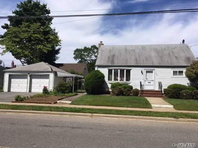 , 2 Car Detached Garage, Updated Heating, New Oil Tank, Some New Windows, 4 Bedroom 2 Full Baths, Hardwood Floors Under Carpets, Large Master Bedroom With Walk In Closet, Full Basement