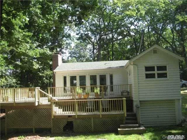 Renovated 1 Bedroom, 1 Bath Cottage On Wooded 1/4 Acre.Spacious Lr/Da With Fireplace, Kitchen, Hardwood Floors. A Wall Of Patio Doors Open To A Large Deck In Country Setting. Short Distance To Beautiful Sound Beach And Goldsmiths Inlet.