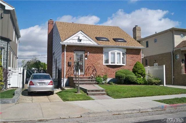 Beautiful 4 Bedroom Brick Colonial With Skylights, 2 Full Bathrooms, 1 Half Bathroom, Wood Floors, Granite Title, Kitchen With Formal Dining Room, Master Bedroom Is A 2 Bedroom Being Used As A One, Huge Full Finished Basement With A Bar And A Gorgeously Brick Paved Backyard.