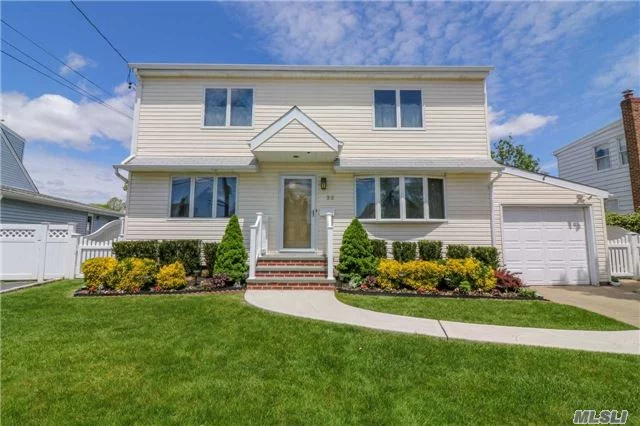 Enormous Arlyn Park Colonial, Located Mid Block, Offers 3-5 Bedrooms, 3 Full Baths, Eik With 32 Feet Of Counter Space!! There Are Hardwood Floors Throughout The Home. The Formal Living Rooma Diing Room Have Hardwood Floors Throughout. The Slider Opens Out To The Deck.