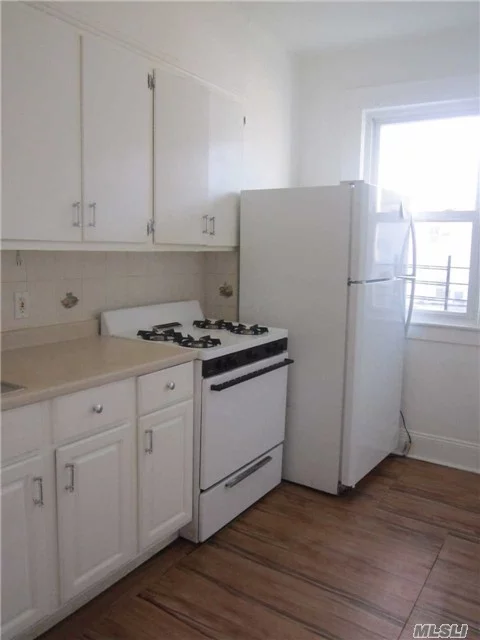 Newly Renovated. Neat And Clean 2 Bedroom Apt, Small Office Rm, Lr/Dr, Eik, Full Bathroom, Close To: Ps 87, Atlas Mall, Q29, Q45, Metropolitan Ave. Small Pet Allowed.