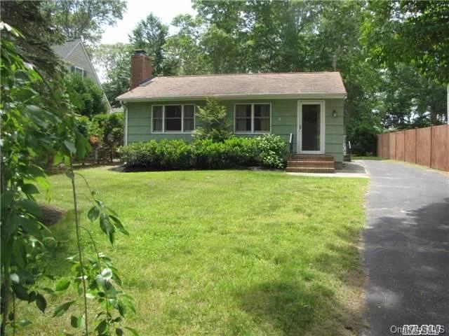 Near-The-Bay Cottage- Living Room Has Wide Plank Pine Floors And A Wood Burning Fireplace- Spacious All Season Sun Room Overlooking A Private Back Yard. Full Basement, Natural Gas Heat. Walk To Community Bulkhead Bay Beach Or Bike A Shy Mile To A Beautiful Park District Bay Beach