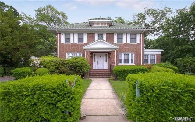 Stately Bright Woodmere Colonial W/ Spacious Entry Leads To Updated Grand Kitchen W/Vaulted Wood-Beamed Ceiling And Wall Of Picture Windows. French Doors Lead To Interlocking Brick Patio And Magnificently Landscaped 100 X 157 Property. Lr W/Wood Floors And Double Sided Fpl, Lg Formal Dr. Master W/Bath (Jetted Shower) And 3 Beds Plus Bath On One Level. A Must See!