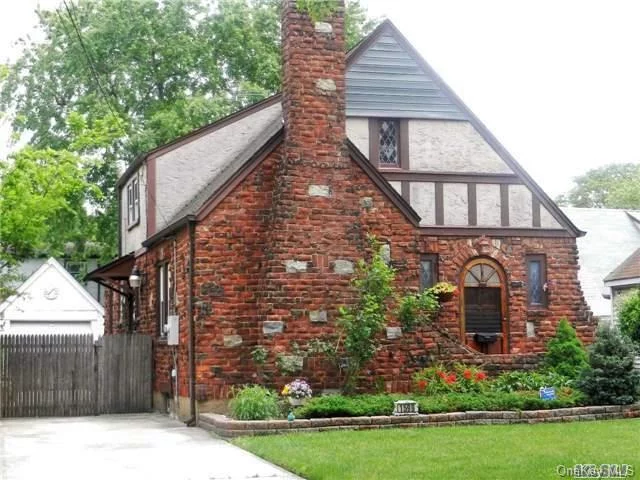 Lovely Tudor Home With Great Curb Appeal & Tons Of Character.Large Lr With 2 Story Ceiling & Alcoved Fireplace. Fdr & Eik (Gas Stove) With Side Door To Outside For Easy Outdoor Entertaining. Basement Is Partially Finished With High Ceilings, Full Bath & Ose To A Backyard That Is A True Oasis. 1 Car Detached Garage Is Fenced In & Private.