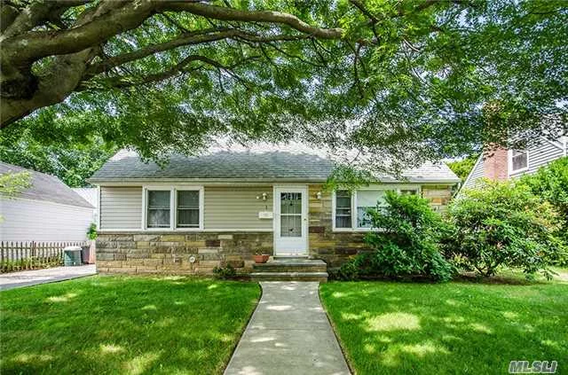 Sweet And Charming Cape Cod Home On A Serene Mid-Block Parcel. This Cozy Home Features Untouched Hardwood Floors, Open Living Room/Dining Room Flow To Eat-In Kitchen, Private Back Deck And Huge Beautiful Flat Yard.