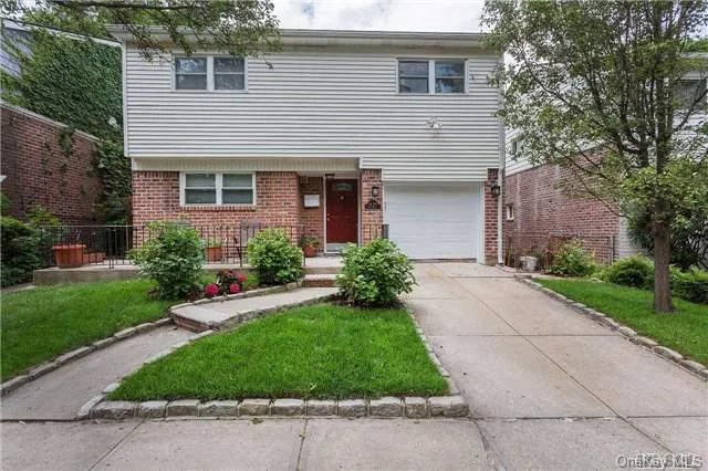 Sunny And Spacious 4 Level Split House On A Great Block! Super Clean And Shows Nicely! Hardwood Floors Throughout, New Floors In The Finished Basement. Central Air Conditioning. Master Bedroom Features Full Bath, Plus Walk In Closet. Private Yard. Convenient To Transportation And Shopping!