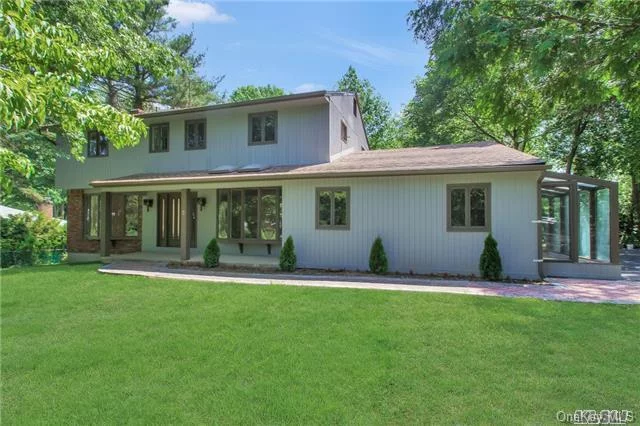 This Lovely Center Hall Colonial Is Situated On A 1+ Acre Property With A 700Sq Ft Log Cabin As Is, This Home Boasts Beautiful Hardwood Floors, Freshly Painted, 4 Bedrooms, 3.5 New Baths, Master Suite W/Fbth, Updated Kitchen W/New Ss Appliances, Mud Room, Garage Converted Into A Playroom/Greenhouse, Full Finished Basement W/Sliding Doors Leading To The Backyard, Great Location.