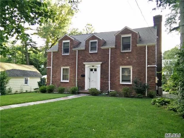 Beautiful Brick And Spacious Center Hall Colonial. Hardwood Flrs Throughout, Has A Bedroom/Office On First Floor W/Seperate Entrance. Located In A Peaceful And Quiet Block, Near Allenwood Park & Worship. Easy Access To Northern Blvd & Major Highways, 20 Min Walk To Town/Rr Or Take Bus Around The Corner To Rr.