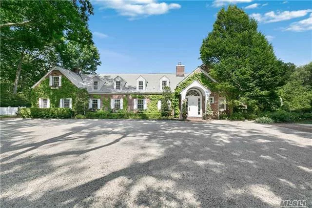 Exquisite 9.66 Acres On One Of North Shores Most Prestigious Streets. This Brick Carriage House Has Been Renovated To Perfection. Open Flow Living Room To Dining Room With Soaring 2 Story Ceilings, 12 Wood Plank Floors, Gourmet Kitchen. Secluded Pool W/Pool House. Smart Home, Led Lighting, 7 Zone Sonos, Whole House Generator, Tesla Charging Station, Cottage W/ 1 Br Apt.