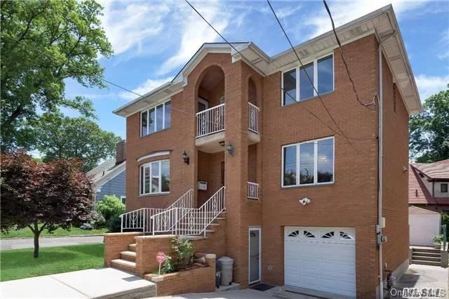 Lovely 5-Bedroom Colonial Located Next To Oakland Lake. Completely Updated, Modern Kitchen W/Marble Counters, Deck In Back Yard. Two Full Bathes W/Jacuzzi, High Ceiling Bsmt W/Home Theater & Separate Entrance To Back Yard. Walk To Transportation Q12, Q13, Q27, Qm3, Lirr,  Schools, Shopping & Restaurants. Location! Location! Location! Move-In Ready!