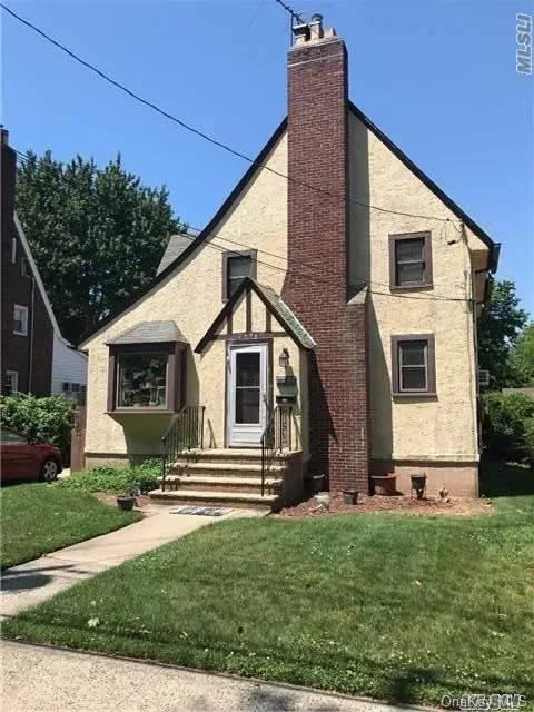 Charming 3 Bedroom Tudor In Baldwin. This Home Boasts Large Den With Fireplace, Open Kitchen And Large Family Room. Situated On An Oversized Property.