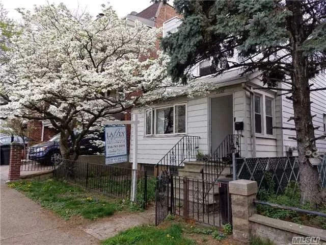 Upper Astoria Section Of E. Elmhurst Aka Upper Ditmars, 2 Family House With Finished Basement, Near Everything, Train, Buses, Restaurants, Stores But Yet Residential Quiet Block, House Being Sold As Is, Great Potential,  Large Yard With Storage Garage.