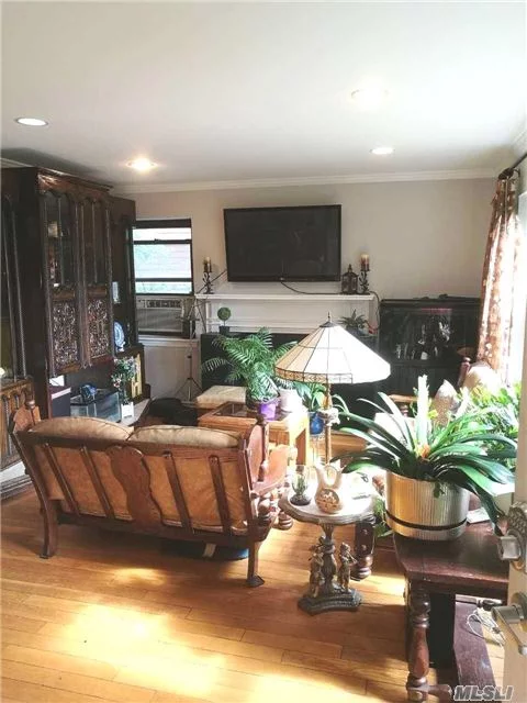 Beautiful And Sunny 3 Bedroom Apartment. Features Open Floor Plan, Renovated Kitchen, Living Room With Fireplace, Dining Area And 2 Full Bathrooms. Finished Basement With Laundry Rm And Separate Entrance. Abundance Of Closet Space. Sole Use Of Garage For Storage Or Parking With Personal Door. Huge Shared Back Yard. Great Location Close To Lirr Town And Parkways. Must See!!