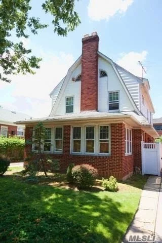 Charming Center Hall Colonial In The Heart Of Bayside. 4 Bedrooms, Livingroom With Fireplace, Original Wood Floors, Sliding Doors From Breakfast Room To Patio. Half A Mile To Either The Bayside Or Auburndale Lirr Stations.