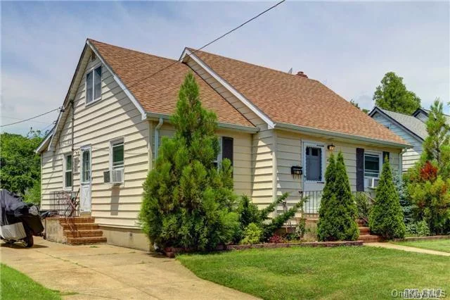 Mid Block Location 4 Bed 2 Bath Full Finished Basement With Side Entrance .Updated Kitchen & Bath Room. Brand New Gas Boiler, Low Taxes . New Roof & Siding , Low Taxes . Wont Last