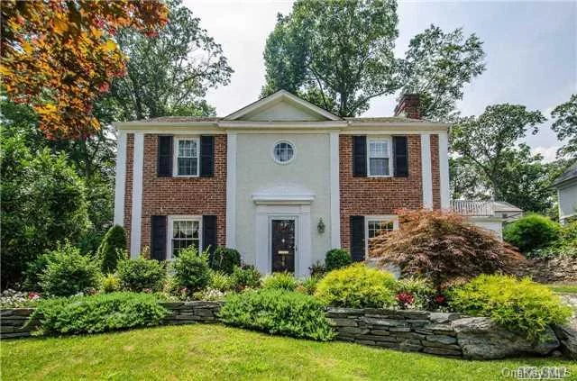 Stately Center Hall Colonial Located In The Beautiful Vlg Of Plandome. Tastefully Updated And Expanded, The Large Gourmet Kitchen Flows Through The Eat In Area And Into The Generously Sized, Light Filled F/R. Very Spacious L/R W/Fpl And Modern Open Floor Plan, Perfect For Entertaining. 3 Lg Bdrms Inc A Mbr W/Bth. Lush Property, Plandome Train, Munsey Pk Elem. Low Taxes!