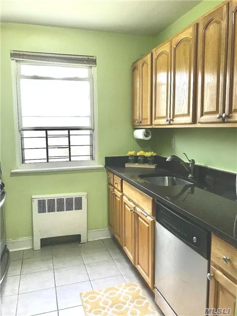 Light, Bright, Spacious And Move-In-Ready One Bedroom, Second Floor Unit. Complete With Combo Living/Dining Area, Granite, Stainless-Steel Kitchen, King-Sized Bedroom And Personal Washer/Dryer Combo In The Unit! Tons Of Storage, Including Attic Area. Conveniently Located To All Transportation (Including Express Bus To Manhattan), Shopping And Schools. Don&rsquo;t Miss This One!