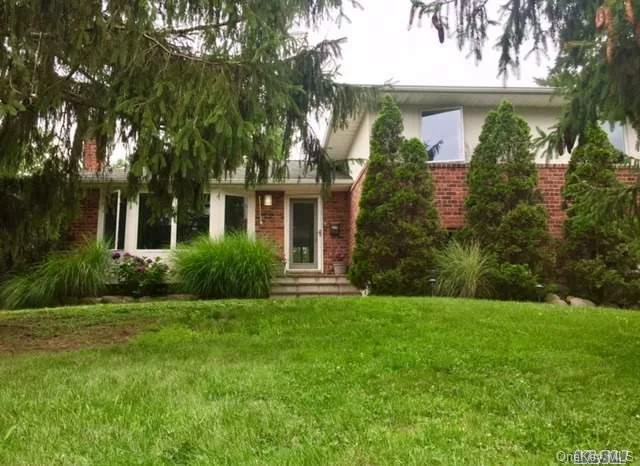 Spacious Brick Split In Sought After Location On .60 Acre Property. Many Updates, Minutes To Syosset, Commute And Shopping. Syosset Sd#2