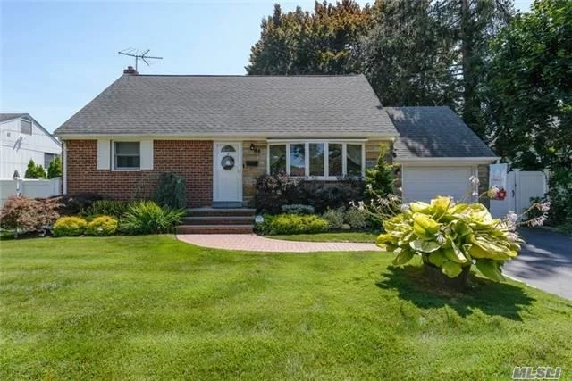 Expanded And Updated 4 Br Cape Wonderfully Located In Desirable Syosset Sd. Fabulous Skylit Great Room With With Sliders To Large Deck. New Bathroom, Cooks Kitchen, Newly Finished Basement, Crown Molding, New Gas Navien Heating System. A Must See!