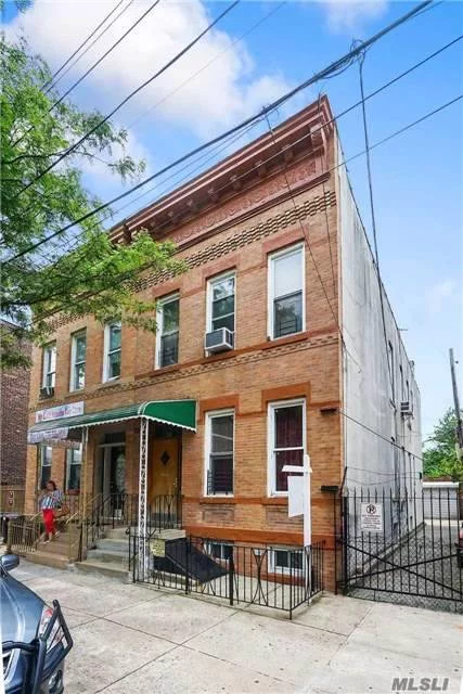 Semi Detached Brick 2 Family Home With 2.5 Car Garage And Private Driveway. Featuring Boxed Rooms, Wood Floors, Private Yard, Full Finsihed Basement. Approx. 3000 S/F Of Additional Air Rights. Great Development Site.