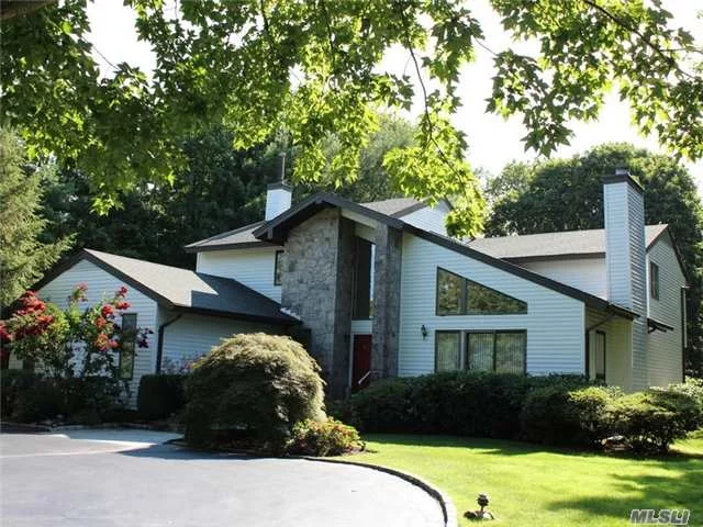 Circular Driveway Leads To This Well-Maintained House On Oversized Property W/Mature Plantings. Additional Features: Power Awning, Gas Generator, Intercom, Time Lights, Central Vac, Alarm System & Termite Contract. Common Charges $445/Month