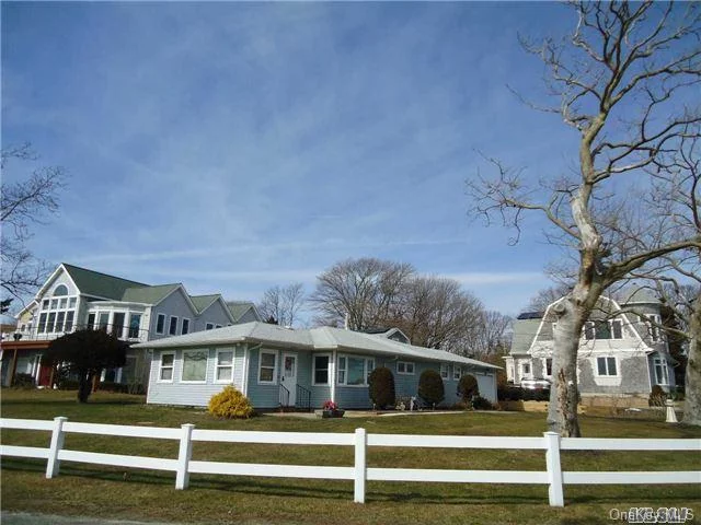 Wonderful Light Filled 3 Bedroom, 2 Bathroom Ranch With Water Views Of Corey Creek, Moyle Cove, And The Peconic Bay. Included In The Sale Is 2340 Minnehaha Blvd., A Waterfront .20 Acre Lot (W/ Bulkhead & Dock), Across The Street. True Taxes For Both Properties: $8079.88 W/O Star. Both Properties Are Part Of Laughing Water Property Owners Assoc..$185.00 Fee/Year. Fantastic!