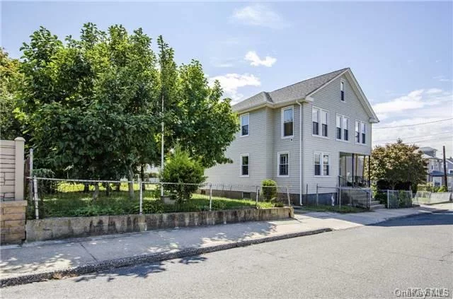 Wonderful Investment Opportunity For Legal 2 Family! Each 2 Bedroom Unit Receives $2200 Rent Each Per Month. Large Lot On Left Deeded To Property, Perfect For Parking, Play Area, Or Garden. Convenient Location To Parks, Schools & Train.