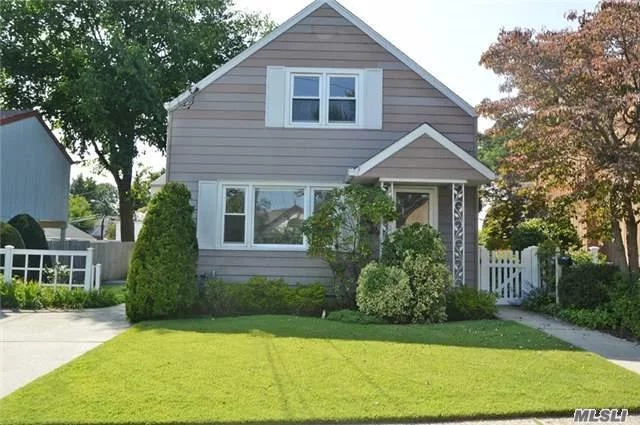 Lovely Two Family In Orchard Beach Section Of Port Washington, Doll House, 2 Over 2, Private Side Entrance To A Nice Income Producing Apartment, Full Basement With A Washer And Dryer, Backyard Beautifully Maintained With A Gorgeous Lawn, Wonderful Curb Appeal, Gated, Great Appearance.