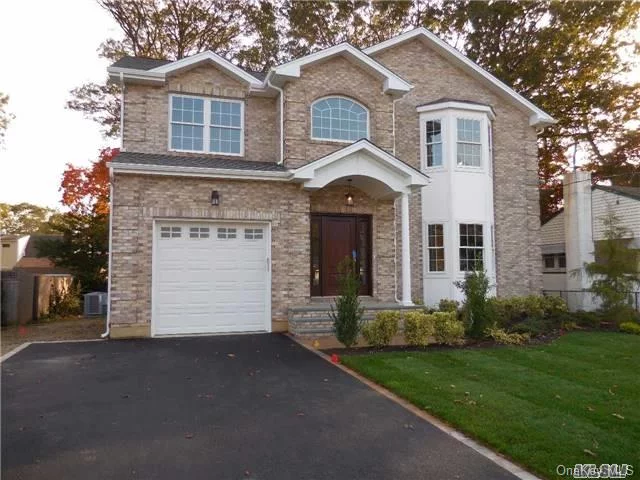 Exquisite New Construction In Massapequa Woods. Completion Expected November. Brick Colonial. Kitchen W/Island, Ss Appliances. Sliders To Yard. Familyroom W/Gas Fireplace. 9&rsquo; Ceilings, Crown Moldings, Tray Ceiling, Wood Floors. Oversized Master En Suite W/2 Walk In Closets & Private Full Bath. Northern Exposure. Blue Ribbon Awarded Schools #23 Massapequa