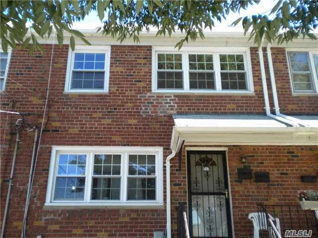 Brick Townhouse Style Colonial. Apt. In House, 2nd Floor Unit. Large Living Rm, Formal Dining Rm, Large Kitchen,  Two Spacious Bedrooms With Large Closets. Washer & Dryer In Basement. All Utilities (Gas, Electric & Water) Included. Walk To Q25 Bus (To Flushing - Main Street) & Hermon Macneil Park And Waterfront.