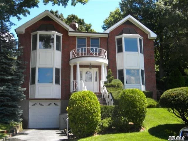 Lovely Renovated Brick Colonial. 5 Bedrooms, 3 Full Baths, Updated Eat-In-Kitchen, Formal Dining Room With Fireplace, Living Room With Fireplace. Partially Finished Basement, Hardwood Floors Throughout. Close Proximity To Town & Lirr.