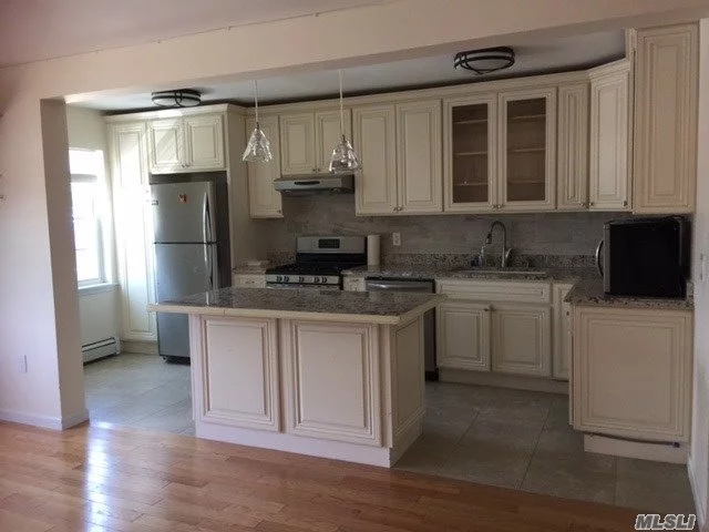 Mint Condition, Completely Renovated In The Luxurious House. Custom Island Open Kitchen, Totally Hard Woods Floors W/ Built In Cabinets , New Bathroom. 3 Ductless A/C . Including One Parking .Convenient To Park , Shopping And Varieties Of Restaurants. Close To Lirr (  Bayside Station)10 Minutes Away.