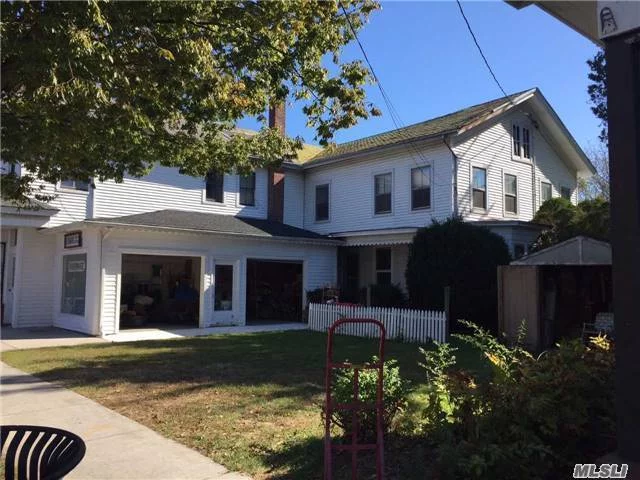 Hamlet Business Zoned Storefront With Plenty Of Storage & Attached Residence Featuring 4 Bedrooms, 1.5 Baths, Kitchen, Lr, Dr, Family Room, Porch. Courtyard Area In Front Of Residence, Parking In Rear For 4-6 Cars.